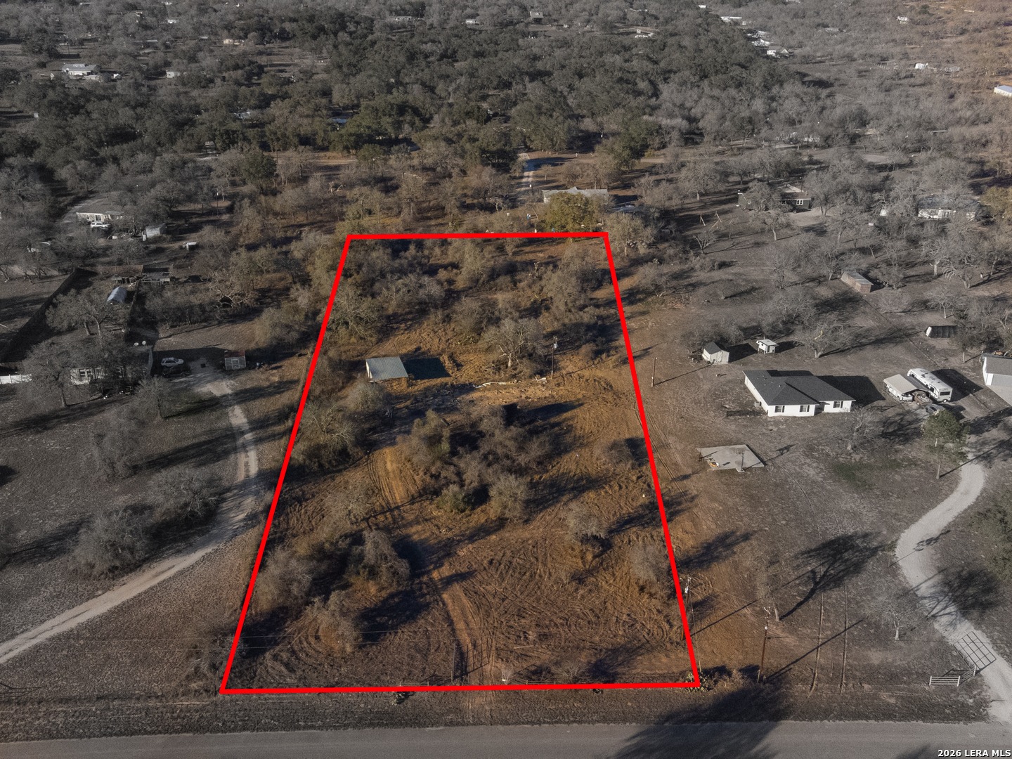 Aerial view of 305 Sara Ln with the property outlined